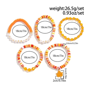 Close-up of Thanksgiving bracelet set featuring colorful beads and maple leaf charms