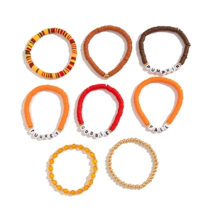 Detail of 8-piece Thanksgiving beaded bracelet set with pumpkin and turkey themed charms