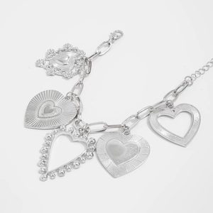 Detailed view of silver lava heart pendant necklace with multi-heart charms and thick chain