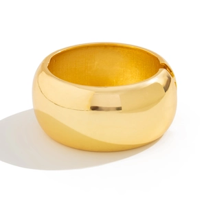 Minimalist thick golden cuff bracelet with high-polish mirror finish and spring hinge