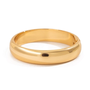 Polished gold water ripple wide bangle with minimalist metallic finish and hinge clasp