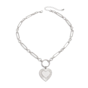 Detail of silver lava heart pendant with textured outer ring and thick link chain necklace