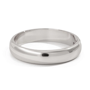 Polished silver water wave textured wide bangle bracelet with a minimalist metallic finish