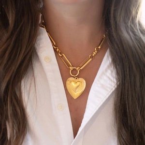 Lava gold heart pendant necklace with textured outer layer and stylish paperclip chain