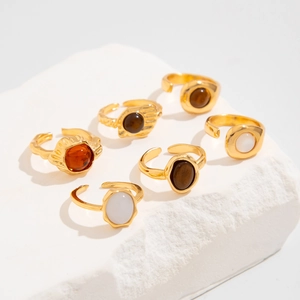 Set of 6 vintage gold-tone adjustable rings featuring colorful gemstones and textured details