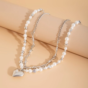 Double-layered pearl necklace with silver heart pendant and barbed wire chain