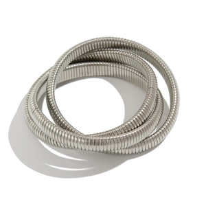 Detailed macro view of silver multi-layer snake bone bracelet with spiral texture