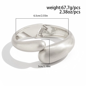 Detail view of silver matte cuff bracelet showing weight 67.7g and dimensions on white background