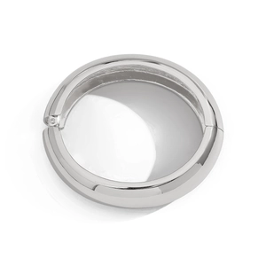 Detail of silver polished metal bangle showing the hinge closure and sleek mirror finish