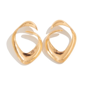 Macro detail of abstract golden twisted earrings with smooth polished metallic texture