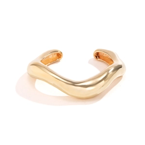 Minimalist liquid metal style irregular wavy open bangle with polished gold finish