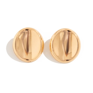 Detailed macro view of golden oval earrings with unique pleated wavy metal texture