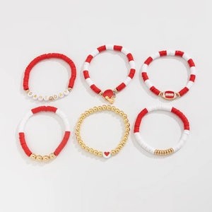 Detail view of 6-piece Game Day beaded bracelet set with football charms and red heart motifs