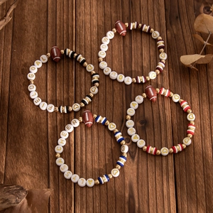 Set of four clay bead bracelets with football charms and game day letter beads