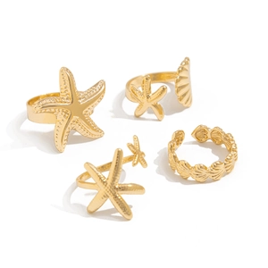 Golden 4-piece ocean theme ring set featuring starfish and seashell designs in metal
