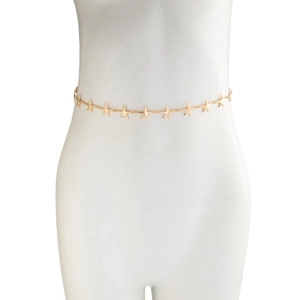 Detailed close-up of golden starfish waist chain worn on a white mannequin torso
