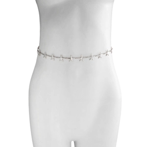 Detailed close-up of a silver starfish waist chain on a white model torso