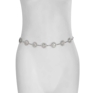 Detail of silver metal sun and moon face charms on a bohemian style belly body chain