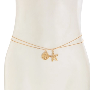 Detail of gold double-layered body chain with starfish and seashell charms on white