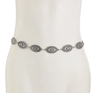 Detail of vintage silver waist chain with sunburst textured oval metal plates