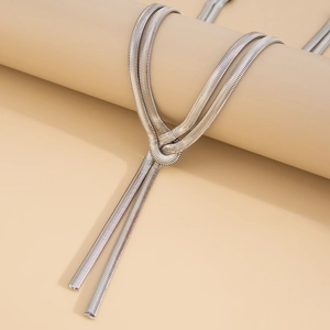 Detailed view of silver snake chain necklace featuring a minimalist knot design detail