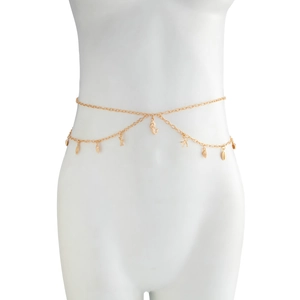 Close-up of gold double-layer body chain featuring starfish, seashell and seahorse charms