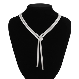 Detailed view of silver flat snake chain necklace with a chic knotted tie design