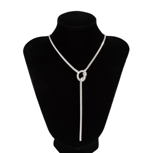 Detail view of silver snake chain necklace with ring toggle and elegant Y-shaped drop design