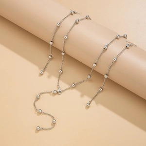 Detail view of silver bead chain necklace with lobster clasp and adjustable extension