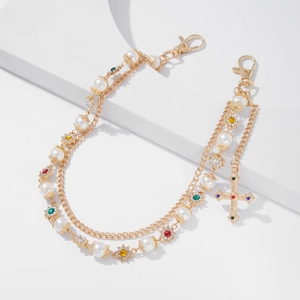 Detail of double-layer chain with pearls, colorful crystal flowers and cross pendant
