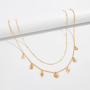 Golden double-layer body chain featuring starfish, shell, and palm tree charms