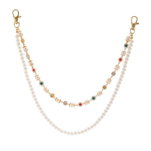 Detail of double-layer chain with white pearls and gold sunflower gemstone charms