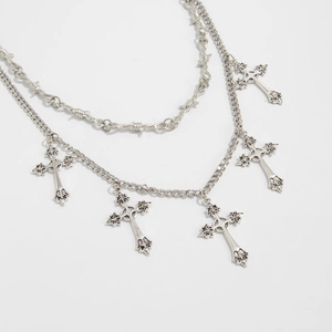 Detail of gothic punk waist chain with double layers, thorn link, and five cross charms