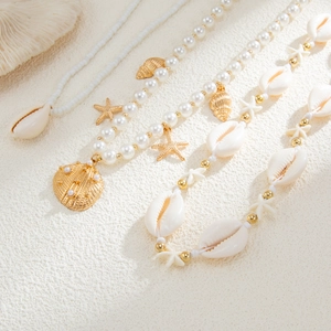 Ensemble de chaîne de corps bohème avec étoiles de mer dorées et perles pour femmes