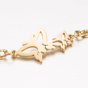 Bracelet chaîne cubaine en acier inoxydable doré avec doubles breloques de papillon