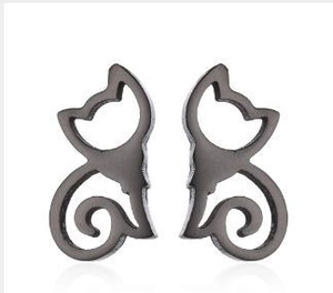 Close-up of minimalist black cat silhouette stud earrings with hollowed-out metal design