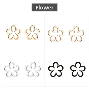 Detail view of hollow flower stud earrings in gold, silver, rose gold, and black steel