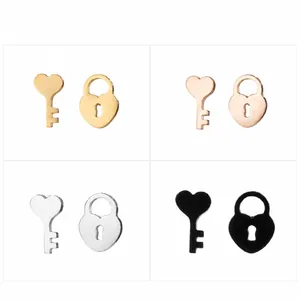 Detailed view of heart-shaped key and lock earring sets in four metallic finishes
