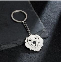 Detailed macro view of a silver stainless steel golden retriever puppy keychain pendant