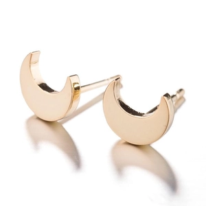 Polished 18K gold plated stainless steel crescent moon stud earrings on white background