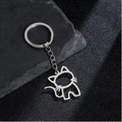 Porte-clés élégant en acier inoxydable avec silhouette de chat évidée sur pierre noire