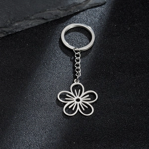 Porte-clés en acier inoxydable avec pendentif fleur évidée et chaîne à maillons métalliques
