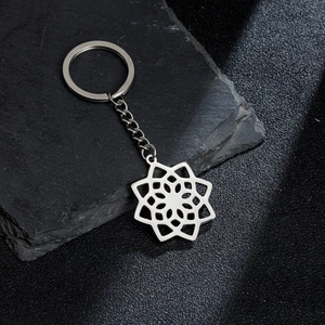 Vintage stainless steel mandala flower pendant keychain with intricate hollow-out geometric design