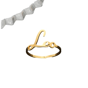 Gold 18K stainless steel Leo zodiac sign open ring with cursive lettering on white background