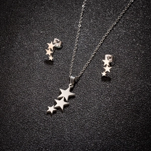 Polished stainless steel jewelry set with triple star necklace and matching stud earrings