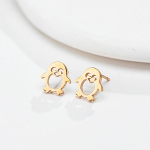 Cute golden stainless steel penguin stud earrings with heart-shaped cutout detail