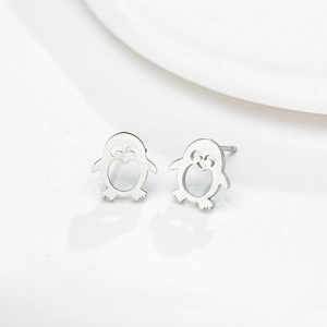 Cute hollow penguin stud earrings in polished silver metal with heart facial details