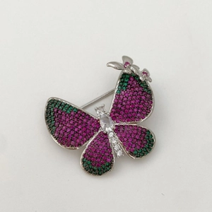 Elegant two-tone butterfly brooch featuring purple and green micro-pave cubic zirconia crystals