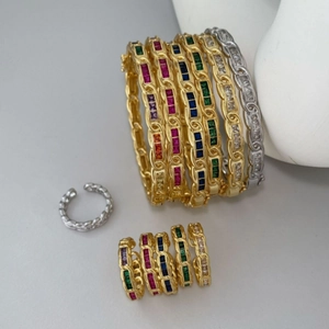 Rainbow cubic zirconia jewelry set including bracelet and rings in gold and silver finish