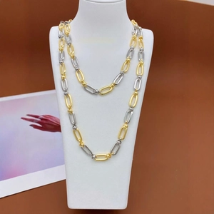 Fashionable dual-tone gold and silver chain necklace with oval links on a model